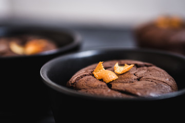 closeup of chocolate muffin and orange zests