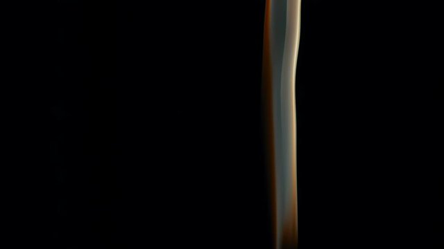 Hot Gas Thin Flexible Jet. A thin stream of smoke curls into bizarre shapes and fills the space. Filmed at a speed of 120fps