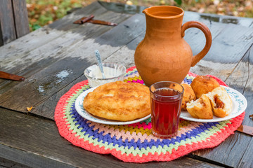 Traditional cossack meal of baked pies and berry drink