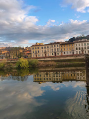 Fototapeta na wymiar Clouds reflected in the Arno river in the city of Florence