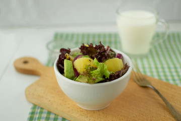 .Dietary salad of potatoes, avocado and red onion. A healthy and light salad is suitable for lunch or lunch.