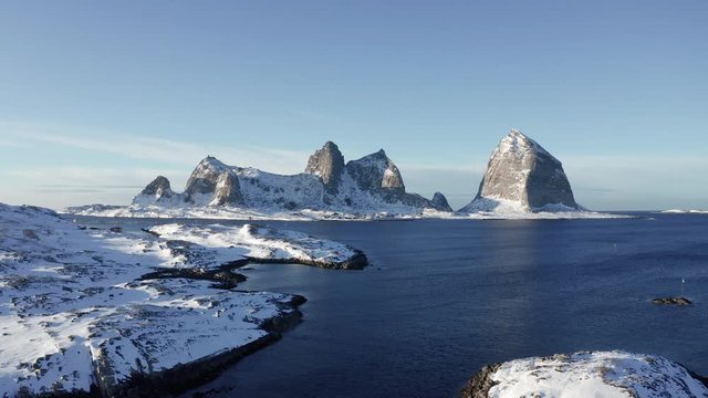 Winter in Tr&aelig;na islands and iconic Sanna mountains, Nordland, Northern Norway, aerial drone shot