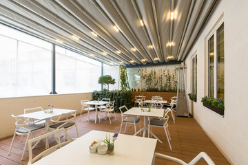 Hotel restaurant terrace interior with heater