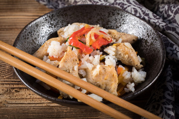 Fried chicken with rice and vegetables.