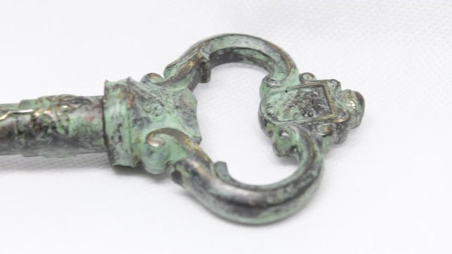 close up of an antique key. Dolly shot