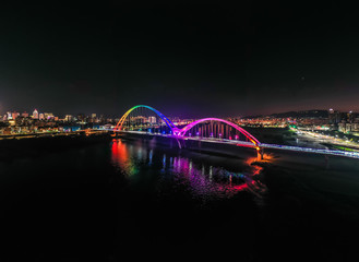 Crescent Bridge - landmark of New Taipei, Taiwan with beautiful illumination at night, photography in New Taipei, Taiwan.