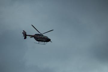 Naklejka na ściany i meble Helicopter in the blue sky