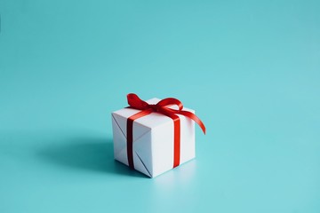 gift box with red ribbon and bow isolated on white