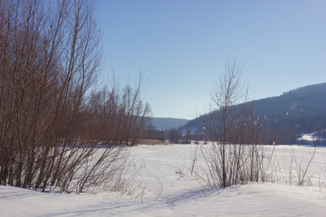 Winter snowy landscape with hills and trees