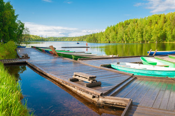 Naklejka na ściany i meble Solovki. landscape lake day, wooden boat
