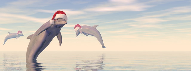 Dolphins celebrating christmas in the ocean - 3D render