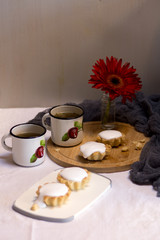cup of tea and cookies on table