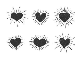 Set of doodle heart shaped symbols with retro styled sun rays. Collection of different hand drawn romantic hearts for sticker, label, love logo and Valentines day design.