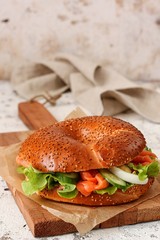 Bagel with salmon and salad