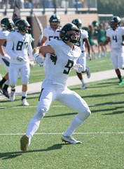 Football player in action during a game in South Texas