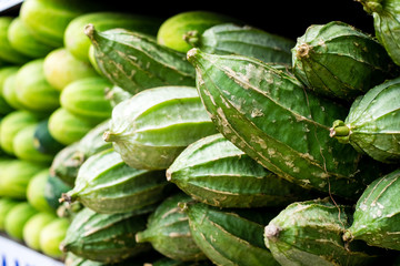 Closeup of organic luffa AKA loofah, lufah, patola, sponge gourd, dishrag gourd, rag gourd, vegetable sponge or Egyptian cucumber. It's used for aromatic and delicious cooking soup and bath sponge.