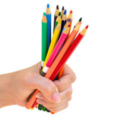Naklejka premium Group of multicolored pencils in young girl's hand. School, colledge and university tools, colorful pencils for drawing graphics and sketching.Isolated on white background.