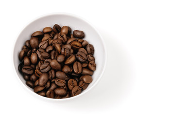 Coffee beans in a white cup. Isolated. White background.