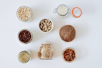 Various raw cereals, grains in glass jars. The concept of zero waste, food storage in the kitchen, healthy nutrition. Top view, copy space for text.