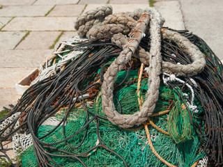 A fishing tackle dries in the sun in the port.