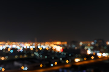 Blurred Photo, cityscape at night. Blurred image background abstract urban background. Night bokeh light in big city. Blurred cityscape view. Abstract light defocused background