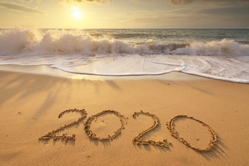 2020 year on the sea shore during sunset