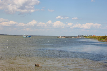The boat on the waves in the river
