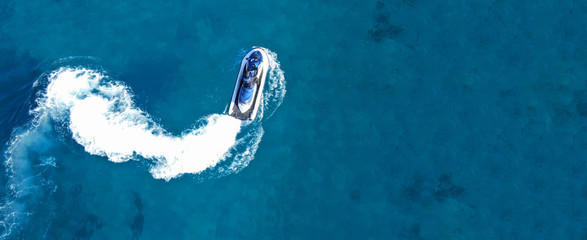 Aerial drone ultra wide top view photo of jet ski water craft cruising in deep blue Mediterranean...
