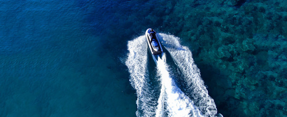 Aerial drone ultra wide top view photo of jet ski water crafts cruising in deep blue Mediterranean...