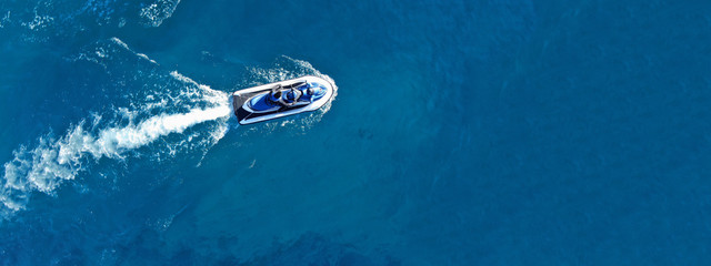 Aerial drone ultra wide top view photo of jet ski water craft cruising in deep blue Mediterranean...