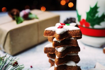 Christmas frosted star cookies on festive holiday background