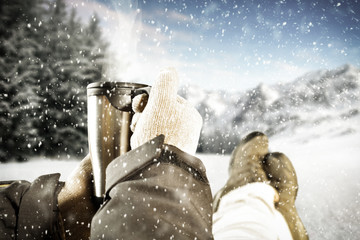Winter background of free space and thermos 