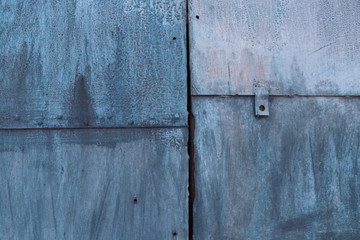 Texture of iron wall painted with blue paint closeup