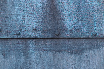 Texture of iron wall painted with blue paint closeup