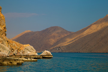 mountains and rocks by the indian ocean in oman