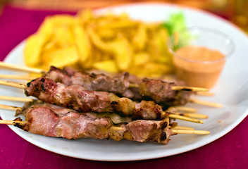 Typical italian meal made of Abruzzo kebabs or 
