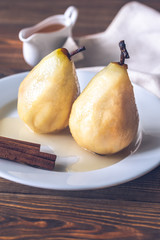 Poached pears on the white plate