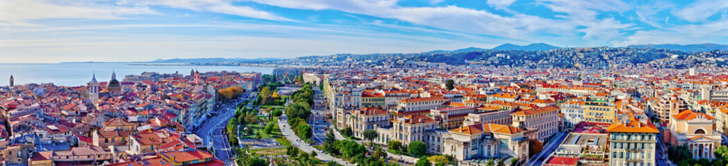 Fototapeta na wymiar Colorful aerial panoramic view over the old town of Nice, France, with the famous Massena square and the Promenade du Paillon, from the roof of Saint Francis tower