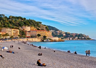 Nice, France - December 1, 2019: view of the beach and walkway promenade on a clear winter day