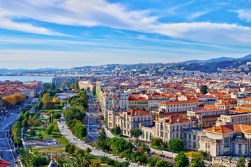 Colorful aerial panoramic view over the old town of Nice, France, with the famous Massena square...