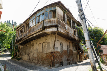 A typical georgian street and yard of an old traditional house and clothes and linen drying on the ropes. Tbilisi Georgia, Caucasus mountains.