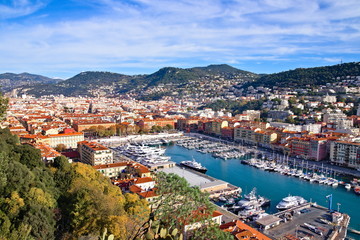 Nice, France - December 1, 2019: Panoramic aerial view over the Lympia port of Nice, France, on a clear winter morning, with Mount Boron hill on background