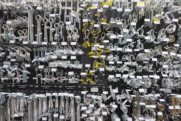 Large group of metallic equipments on display in hardware store