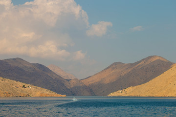 mountains and rocks by the indian ocean in oman