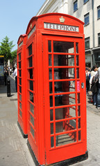 Iconic red public telephone booth in London, England UK