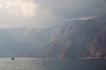 mountains and rocks by the indian ocean in oman