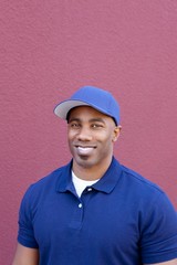 Portrait of a happy young African American man over colored background