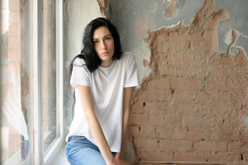 Portrait of a girl in the loft interior