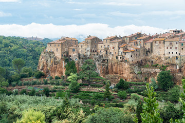 Fototapeta na wymiar Pitigliano medieval village on tuff rocky hill. Panorama landscape photography. Italy, Europe.