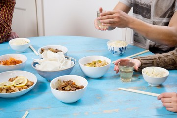Obraz na płótnie Canvas People having breakfast on table together